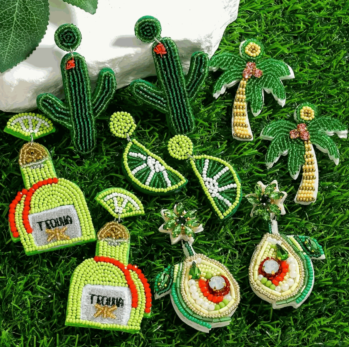 Colorful hand-beaded earrings featuring cacti, palm trees, lime slices, tequila bottles, and avocados for fun summer vibes.