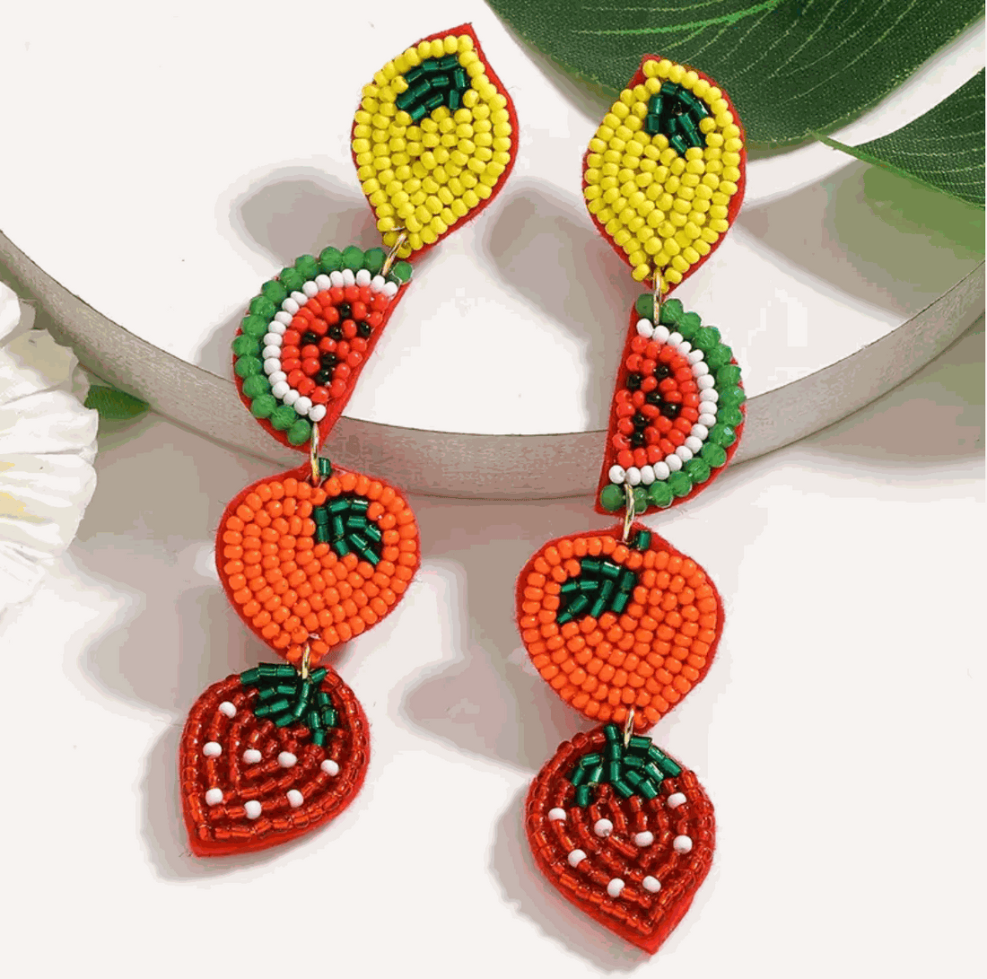 Vibrant Fruit Parade Beaded Drop Earrings featuring lemon, watermelon, orange, and strawberry designs, perfect for a summery look.