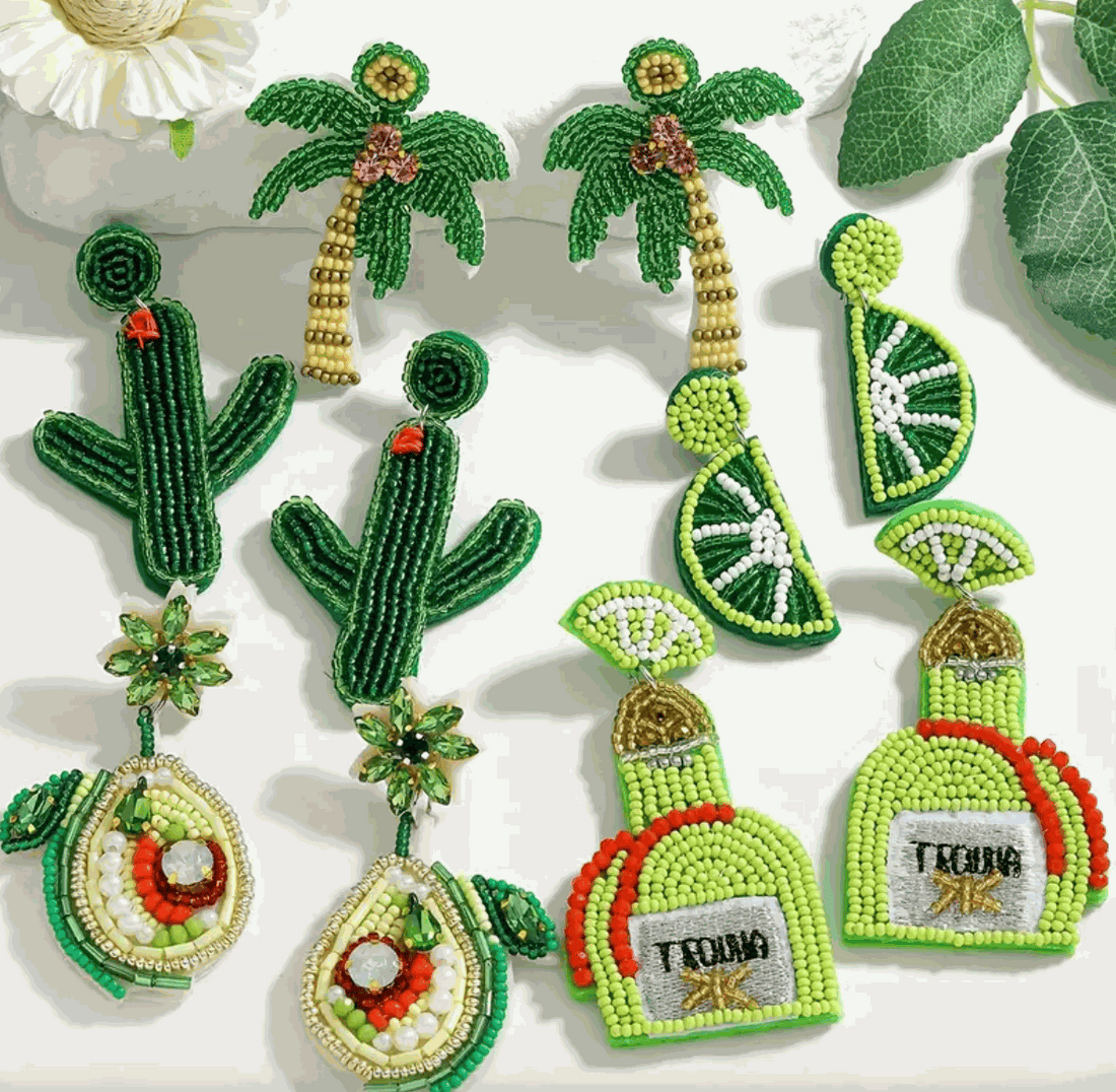 Colorful hand-beaded earrings featuring cacti, palm trees, lime slices, tequila bottles, and avocados for a festive vibe.