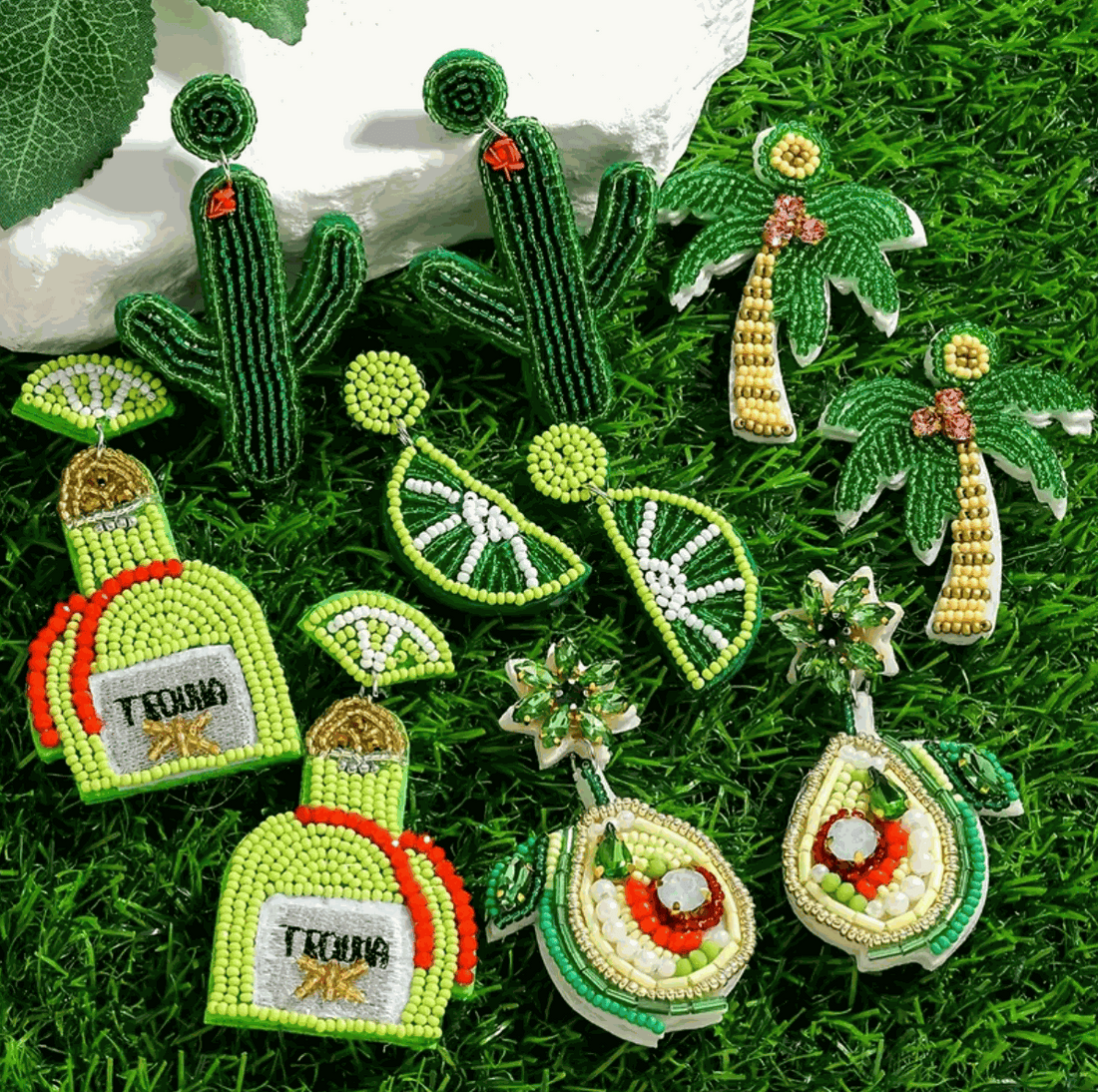 Colorful hand-beaded earrings featuring cacti, palm trees, lime slices, tequila bottles, and avocados for fun summer vibes.
